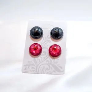Pair of black and pink earrings
